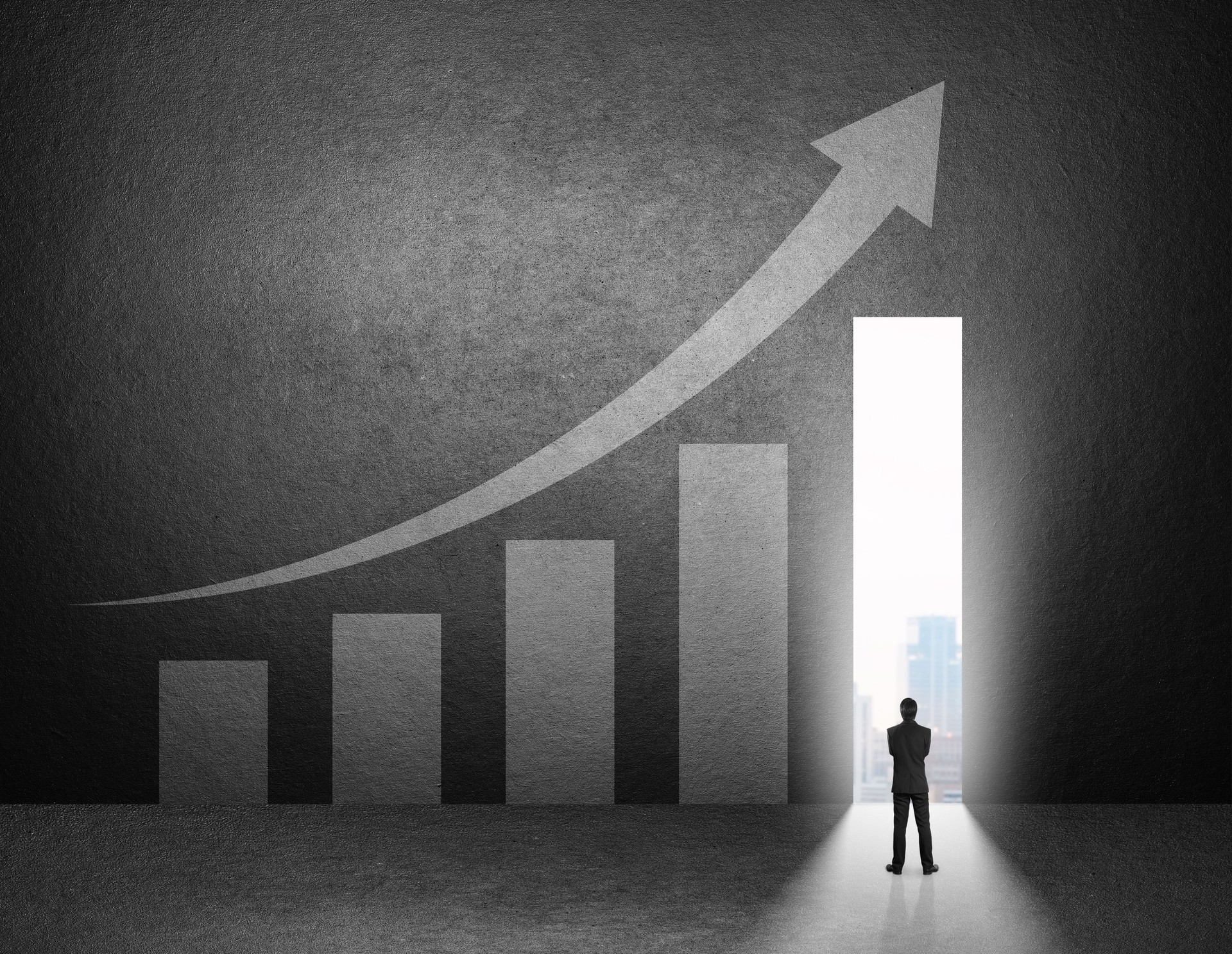 Silhouette of businessman stand in front of the growth chart